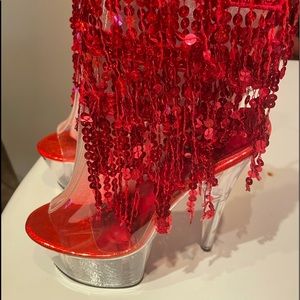 Red heels. Lace up in the back. Size 8 but runs around size 9. Worn once. Red